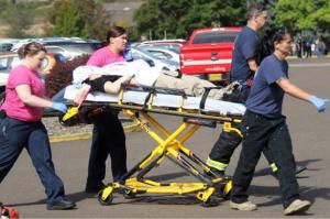 First responders transport an injured person following a shooting incident at Umpqua Community College in Roseburg Oregon