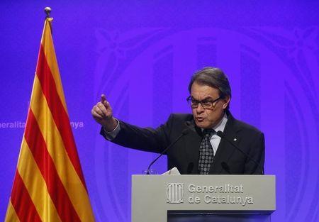 Catalan acting President Mas gestures during a news conference at Palau de la Generalitat in Barcelona
